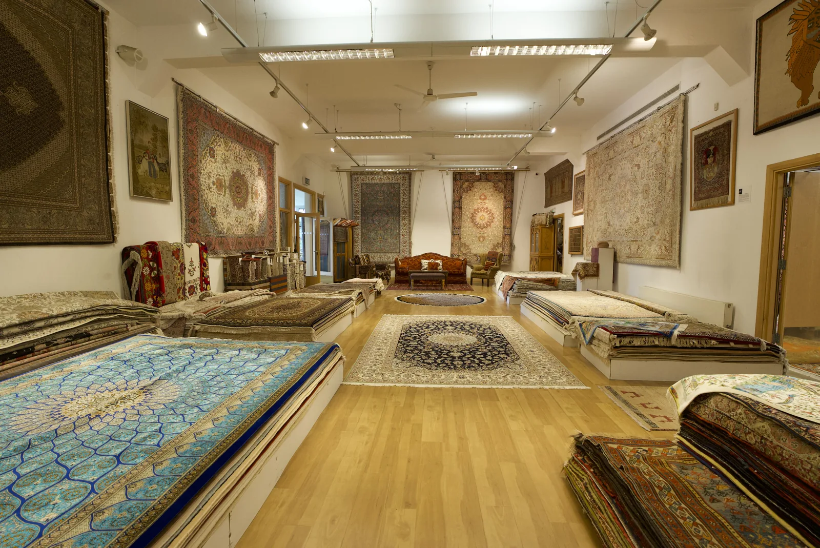 Fine rugs displayed in the smaller showroom